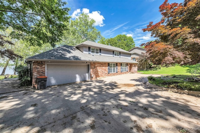 3112 Shore Dr, Grove, OK 74344 - view of front of property with brick siding, concrete driveway, an attached garage, and a shingled roof