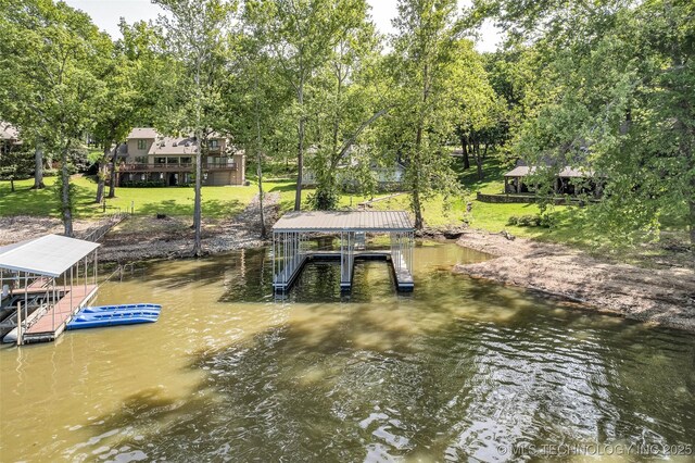 3112 Shore Dr, Grove, OK 74344 - dock with boat lift, a water view, and a yard