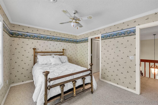 3112 Shore Dr, Grove, OK 74344 - bedroom with crown molding, wallpapered walls, baseboards, carpet floors, and ceiling fan