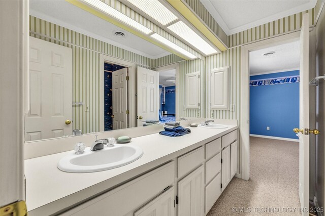 3112 Shore Dr, Grove, OK 74344 - bathroom featuring wallpapered walls, double vanity, ornamental molding, and baseboards