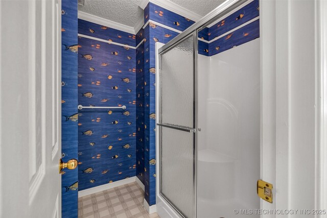 3112 Shore Dr, Grove, OK 74344 - bathroom with tile patterned floors, a textured ceiling, ornamental molding, a shower stall, and baseboards