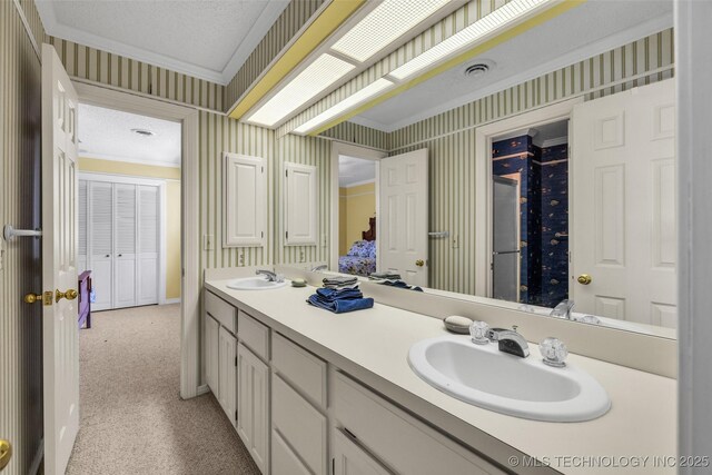 3112 Shore Dr, Grove, OK 74344 - full bath with wallpapered walls, ornamental molding, double vanity, a textured ceiling, and baseboards