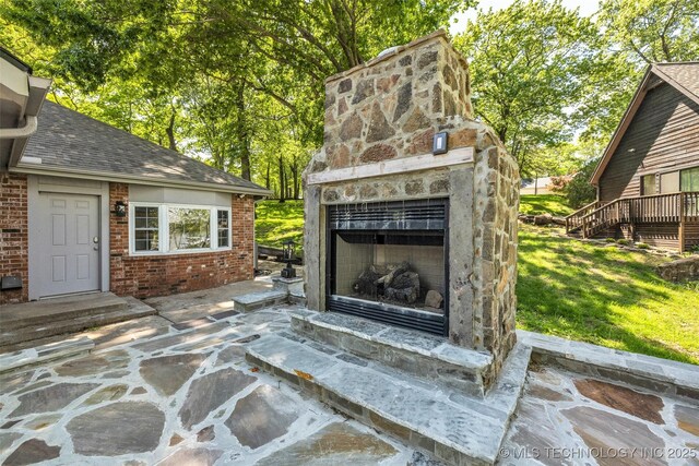 3112 Shore Dr, Grove, OK 74344 - view of patio with an outdoor stone fireplace