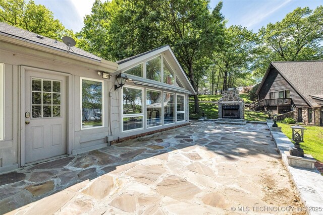 3112 Shore Dr, Grove, OK 74344 - view of patio / terrace featuring an outdoor stone fireplace