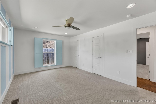 3130 E 47th St, Tulsa, OK 74105 - unfurnished bedroom featuring carpet flooring, recessed lighting, baseboards, a ceiling fan, and two closets