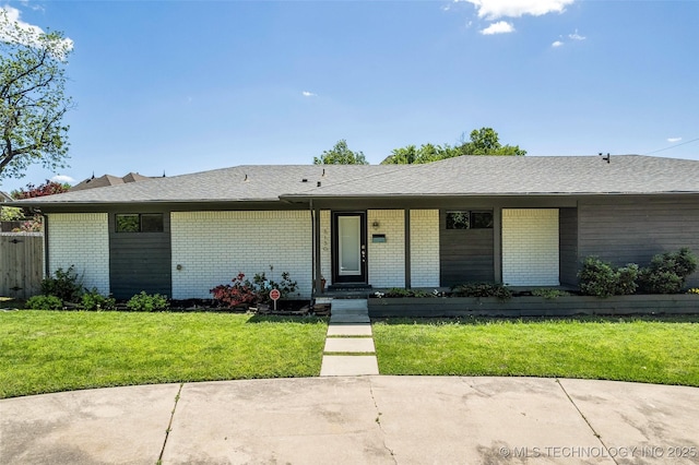 3130 E 47th St, Tulsa, OK 74105 - view of front of property featuring brick siding, a front lawn, and roof with shingles