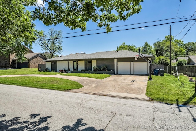 3130 E 47th St, Tulsa, OK 74105 - ranch-style house with an attached garage, driveway, and brick siding