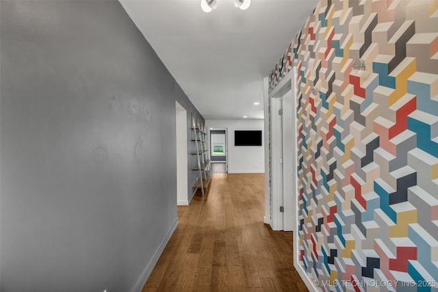 3130 E 47th St, Tulsa, OK 74105 - corridor with an accent wall, wood finished floors, wallpapered walls, and baseboards