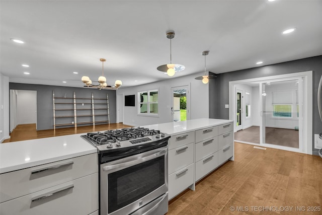 3130 E 47th St, Tulsa, OK 74105 - kitchen with gas stove, white cabinetry, recessed lighting, modern cabinets, and light wood-style floors