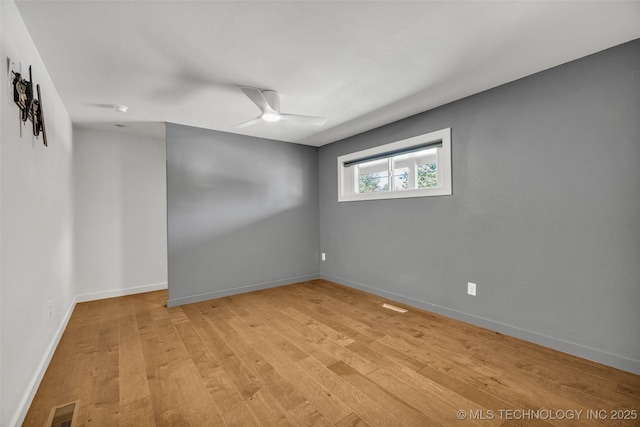 3130 E 47th St, Tulsa, OK 74105 - empty room with light wood-style floors, ceiling fan, and baseboards