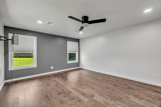 3130 E 47th St, Tulsa, OK 74105 - empty room featuring ceiling fan, wood finished floors, healthy amount of natural light, baseboards, and recessed lighting