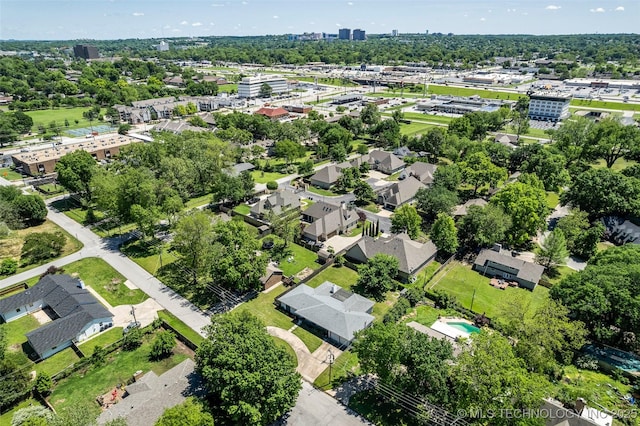 3130 E 47th St, Tulsa, OK 74105 - aerial view of property and surrounding area with a tree filled landscape