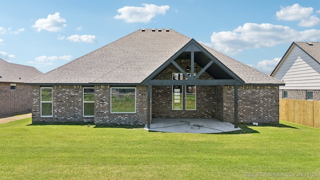 back of house featuring a patio area and brick siding