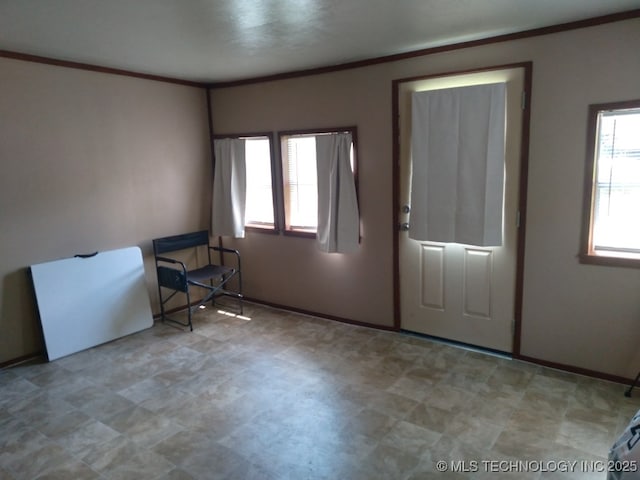 35530 W 261st St, Bristow, OK 74010 - entryway featuring tile patterned floors, ornamental molding, plenty of natural light, and baseboards