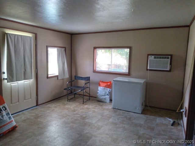 35530 W 261st St, Bristow, OK 74010 - interior space featuring a wall mounted AC, ornamental molding, and tile patterned floors