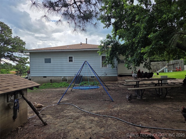 35530 W 261st St, Bristow, OK 74010 - back of property with fence, crawl space, and a playground