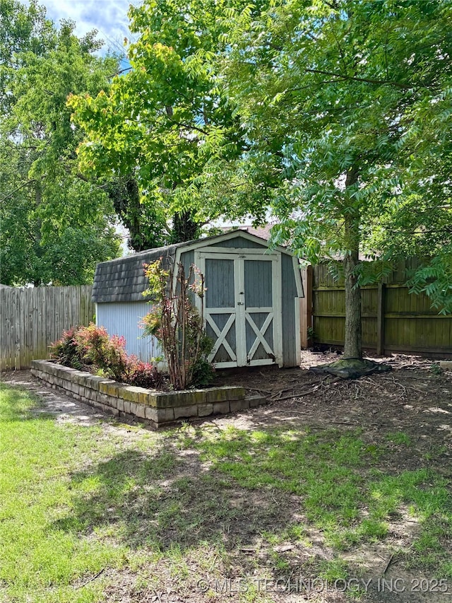 view of shed featuring a fenced backyard