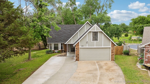 tudor-style house with concrete driveway, brick siding, roof with shingles, an attached garage, and stucco siding