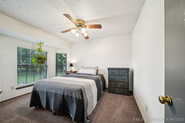 bedroom with carpet flooring, a textured ceiling, and ceiling fan