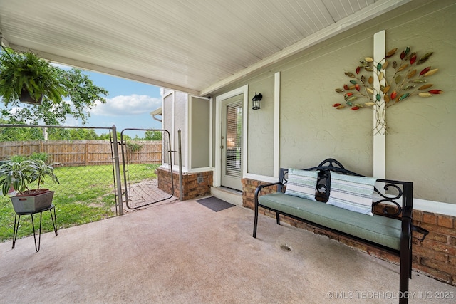 view of patio / terrace with a gate