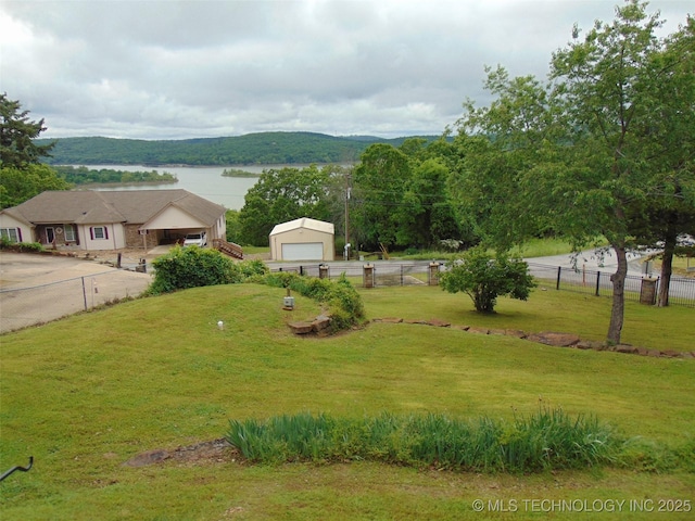 view of yard with a detached garage