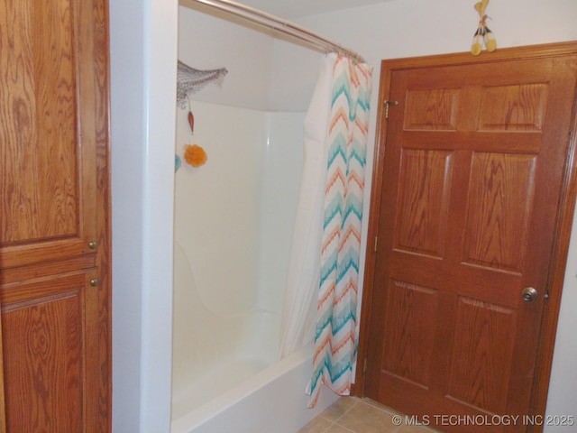 full bathroom featuring tile patterned flooring and shower / bath combo