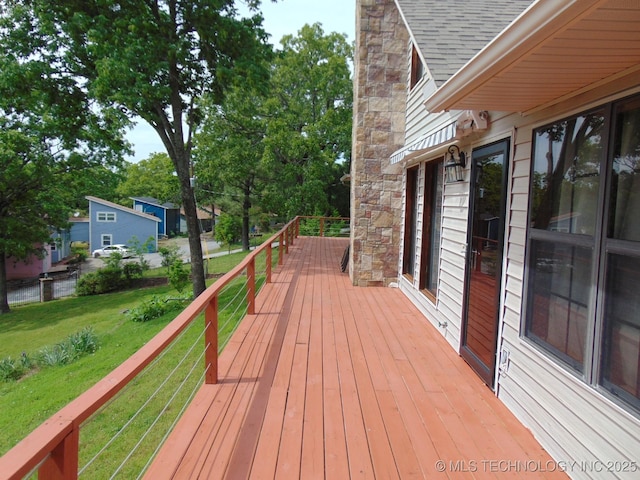 deck featuring a lawn