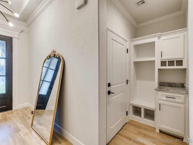 mudroom featuring crown molding and light wood-type flooring