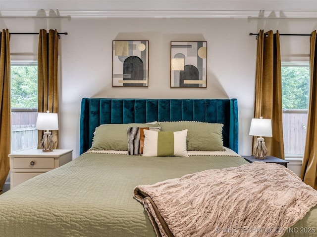 bedroom with crown molding