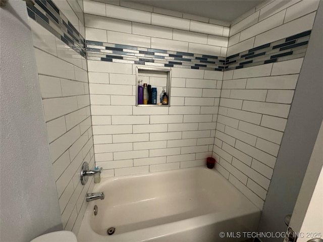 4302 E 67th St Unit 656, Tulsa, OK 74136 - bathroom featuring shower / washtub combination, toilet, and a textured wall