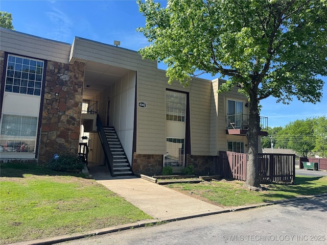 4302 E 67th St Unit 656, Tulsa, OK 74136 - view of front of house with stone siding and stairway