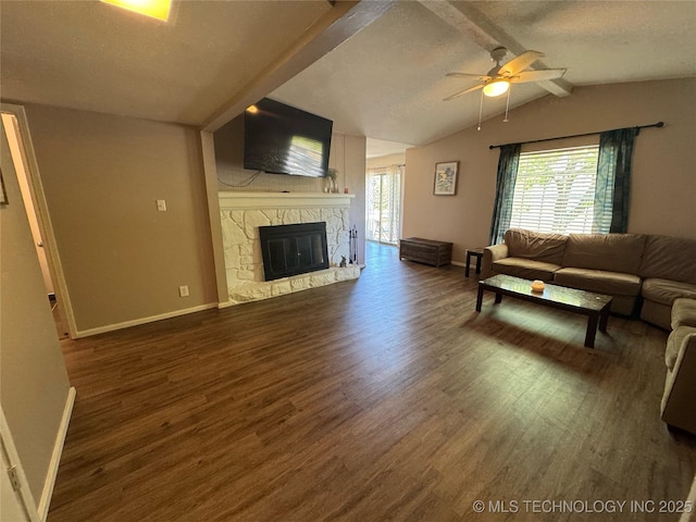 4302 E 67th St Unit 656, Tulsa, OK 74136 - living area with wood finished floors, baseboards, ceiling fan, a fireplace, and a textured ceiling