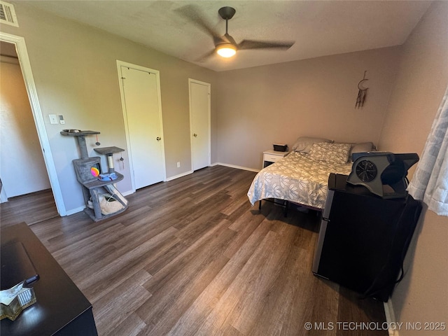 4302 E 67th St Unit 656, Tulsa, OK 74136 - bedroom featuring wood finished floors, baseboards, and a ceiling fan