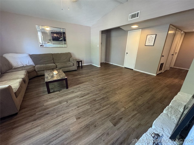 4302 E 67th St Unit 656, Tulsa, OK 74136 - living room featuring wood finished floors, vaulted ceiling, and baseboards