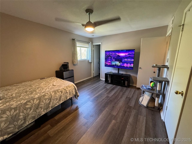 4302 E 67th St Unit 656, Tulsa, OK 74136 - bedroom with wood finished floors, baseboards, and ceiling fan