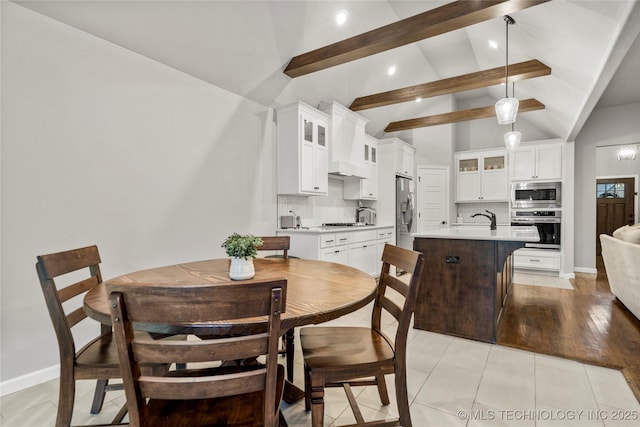 dining space with beam ceiling, recessed lighting, baseboards, high vaulted ceiling, and light tile patterned floors