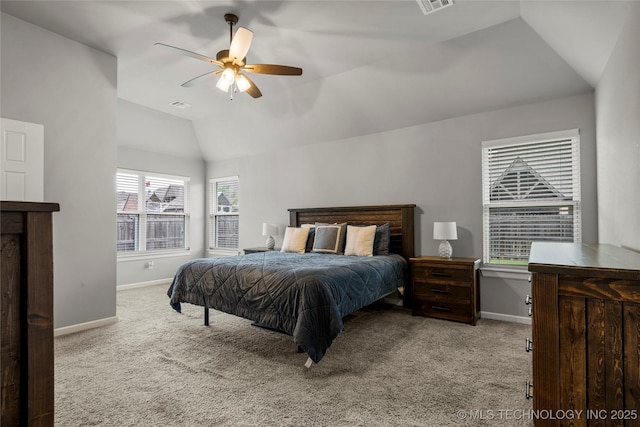 carpeted bedroom featuring vaulted ceiling, baseboards, and a ceiling fan