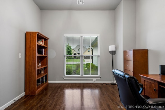 office space featuring dark wood-style flooring and baseboards