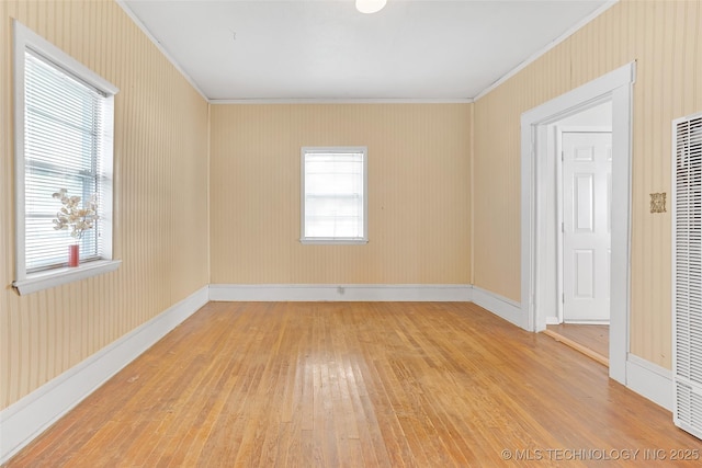 428 E 4th St, Claremore, OK 74017 - spare room with light wood-style flooring, ornamental molding, baseboards, and a heating unit