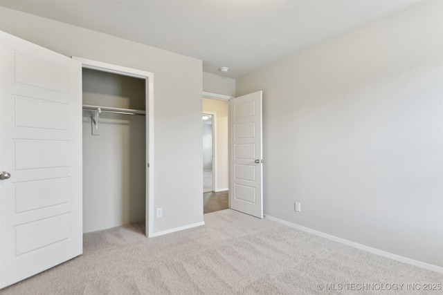 7535 E 158th St S, Bixby, OK 74008 - unfurnished bedroom featuring carpet, a closet, and baseboards