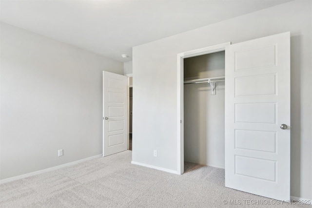 7535 E 158th St S, Bixby, OK 74008 - unfurnished bedroom featuring carpet floors, a closet, and baseboards