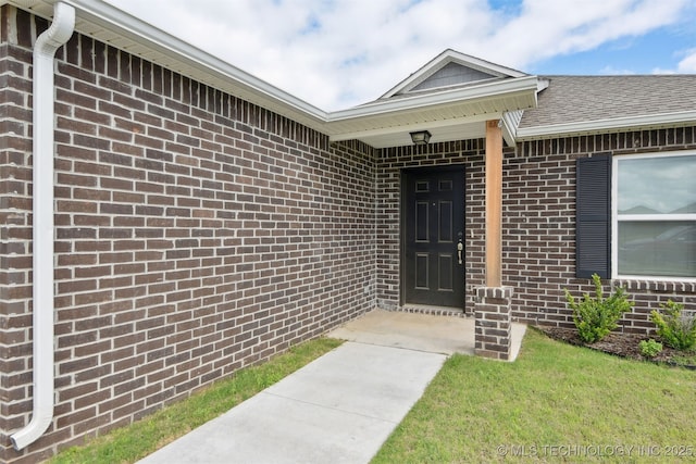 7535 E 158th St S, Bixby, OK 74008 - doorway to property featuring brick siding