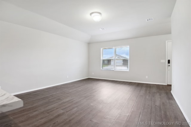7535 E 158th St S, Bixby, OK 74008 - spare room with dark wood-type flooring, baseboards, and lofted ceiling