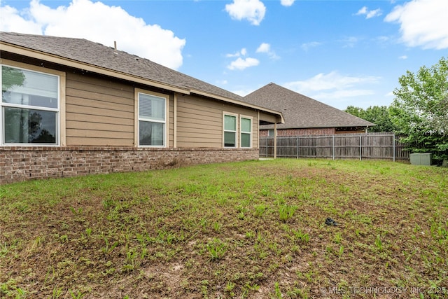 rear view of house with brick siding