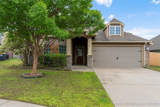 view of front of home featuring a garage, concrete driveway, and a shingled roof