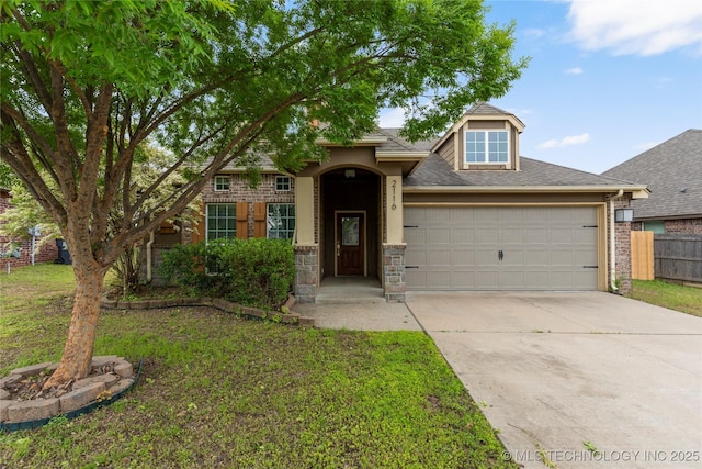 traditional-style home with an attached garage, driveway, and roof with shingles