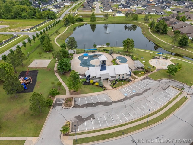 aerial view of property's location with a large body of water