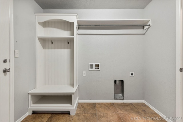 laundry room with electric dryer hookup, washer hookup, and baseboards
