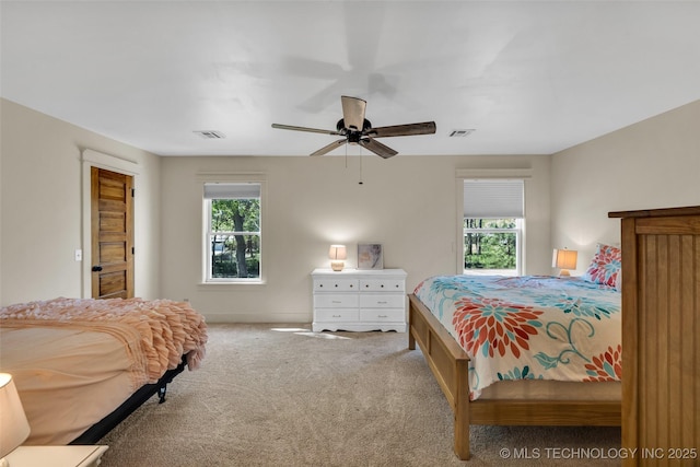 carpeted bedroom featuring a ceiling fan