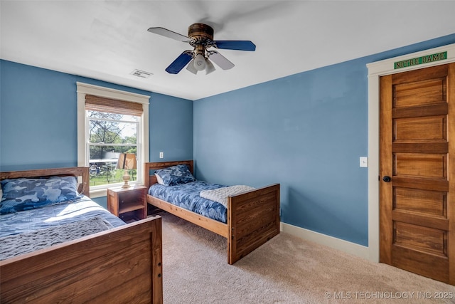 carpeted bedroom featuring ceiling fan